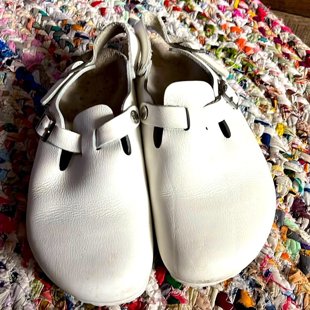 Like new white Birkenstock Tokio worn once. Scruff at left outer toe box.